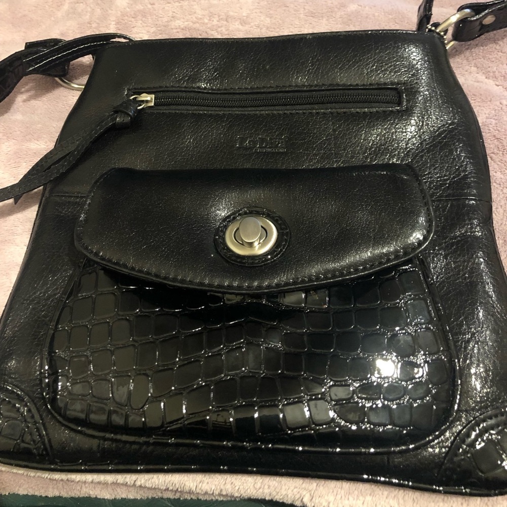 LaDiva vintage black  Italian leather purse    . Patent pockets and strap
